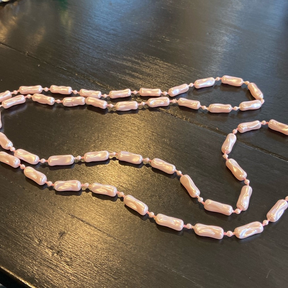 24 inches in length.  This piece can be double looped.   Pink